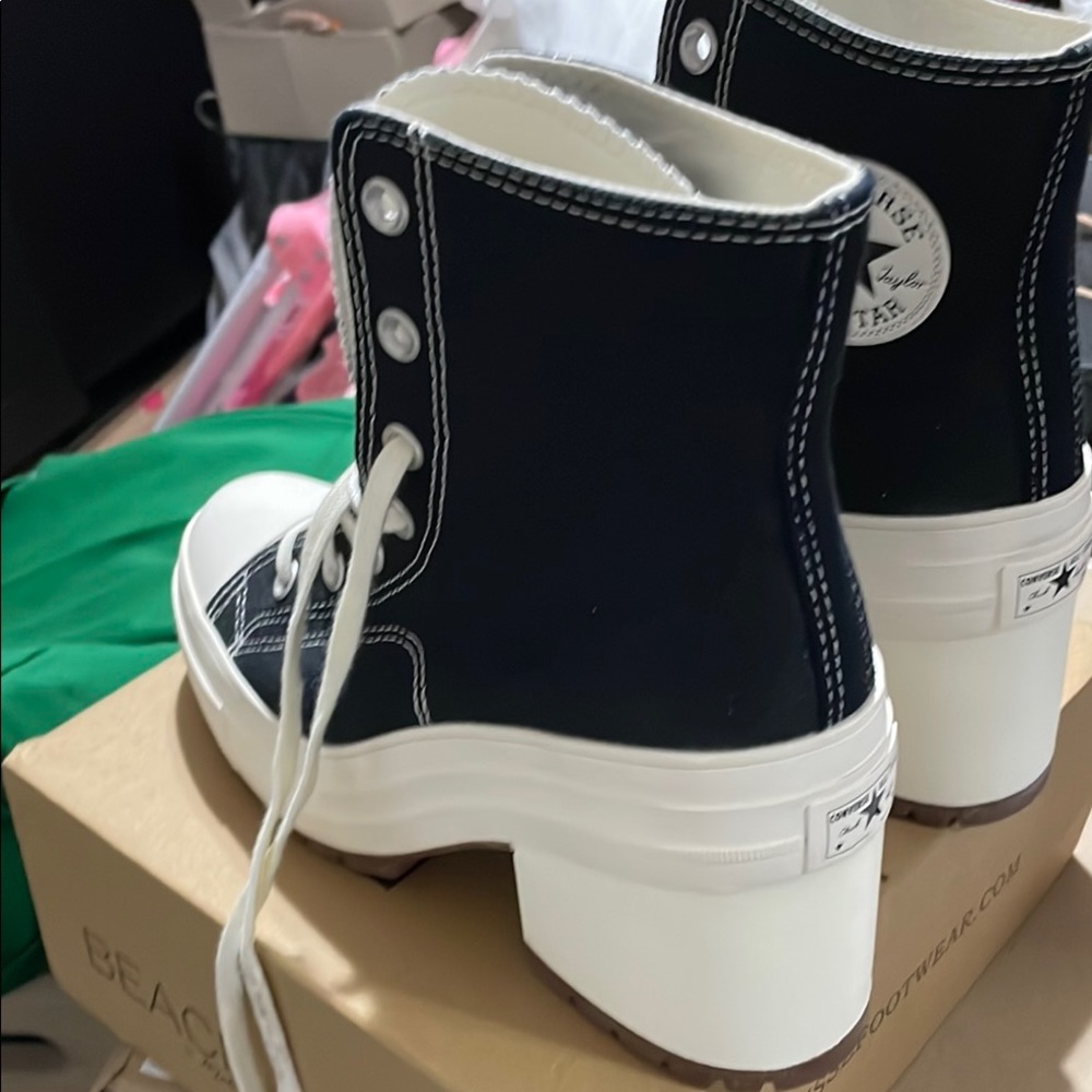 Converse high top sneakers 
One pair black
One pair white
One pair rose pink